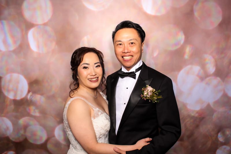 Bride and groom enjoying photo booth hire Perth wedding